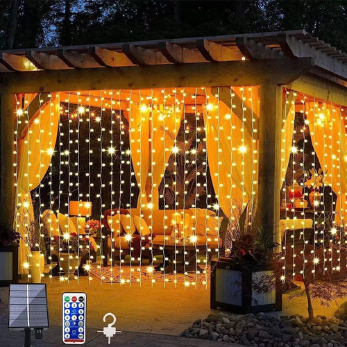 Close-up of solar-powered outdoor string lights with remote control and solar panel for garden decoration