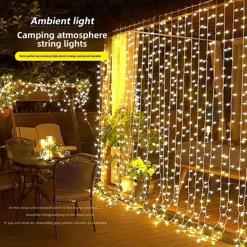 Outdoor wooden pergola decorated with warm white fairy string lights for cozy evening ambiance