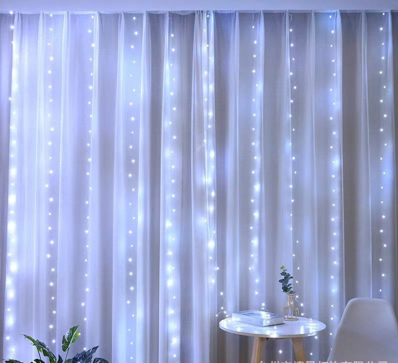 Close-up of LED curtain lights with small bright bulbs on white sheer fabric, perfect for outdoor lighting and decoration